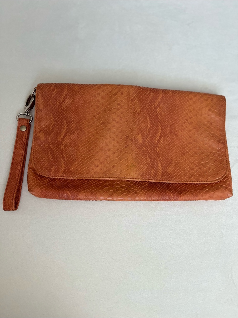 Big Buddha Orange Snakeskin Textured Wristlet Clutch